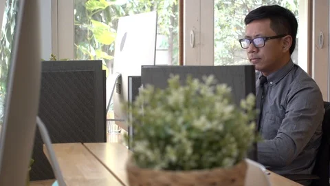 Businessman working with computers and talk to mobile phones in the office. Stock Footage 103039894