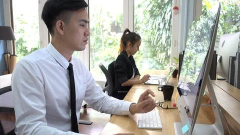 Businessman working with computers in the office. Stock Footage 103036910