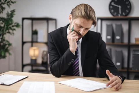 Businessman working with data documents on desk Stock-Fotos