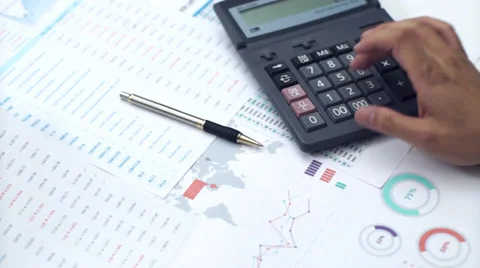 Businessman working with data sheet and using calculator Video stock 39809403