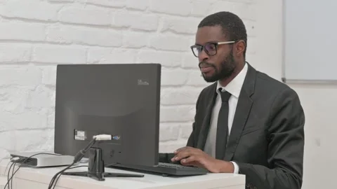 Businessman Working on a Desktop Computer Stock Footage 310169552