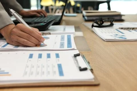 Businessman working with document &amp; computer. startup man analyze financial d Stock Photos