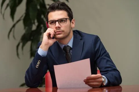 Businessman working with documents in the office Stock Photos