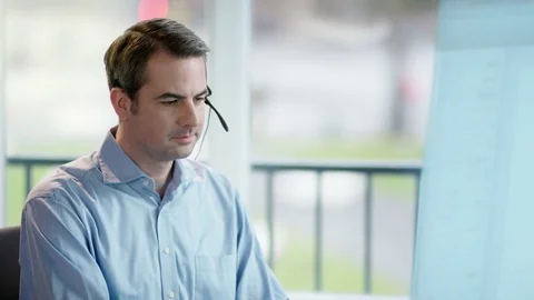 Businessman is working focused in front of future screen Stock Footage 85259695