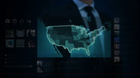 Businessman working on a futuristic holographic interface. US map. Stock Footage