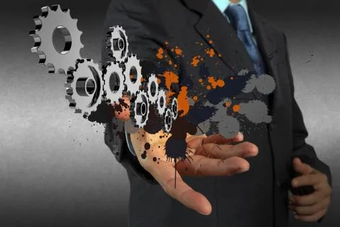 Businessman working with gear and splash colors Stock Illustration