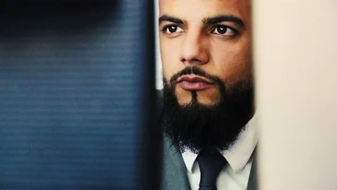 A businessman is working on his computer, reading his screen and smiling 4K Video stock 94760159