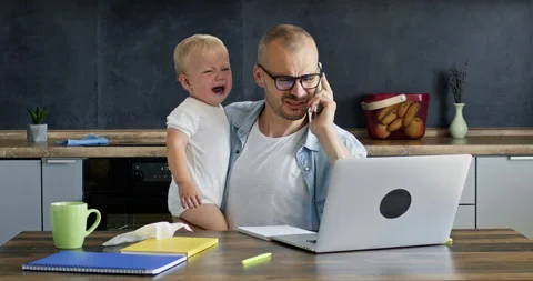 Businessman working on important project tries to calm son Stockbeeldmateriaal 229852213