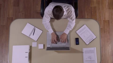 Businessman working on lap-top computer and answering the phone-call Stock-Footage 68713714