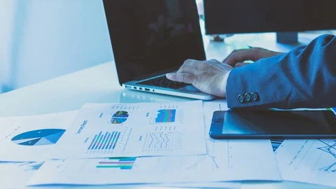 Businessman working with laptop and using smart phone, closedup Stock Footage 98561402