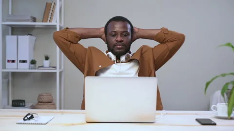 Businessman working with laptop computer and resting at table in modern office Stock Footage 148725862