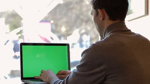 Businessman working at laptop computer in cafe. Green screen Stock Footage 73021072