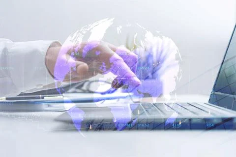 Businessman working on laptop computer with digital world map and financial.. Stock Photos