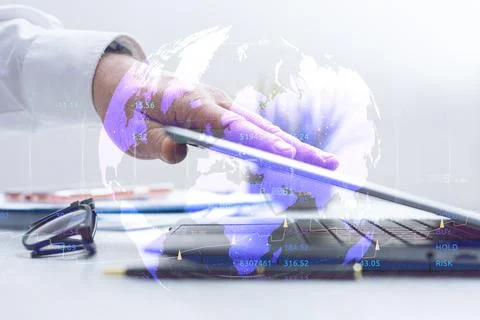 Businessman working on laptop computer with digital world map and financial.. Stock Photos
