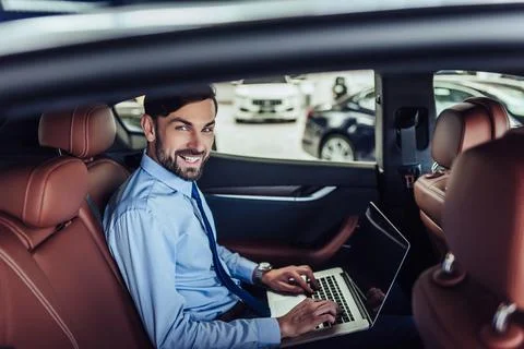 Businessman working on laptop computer Stock Photos
