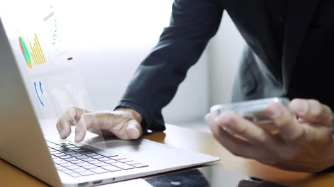 Businessman working with laptop computer, showing chart and graph icons Stock-Footage 246799952