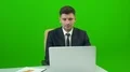 The businessman working with a laptop on the green background 4k or 4k+ Resolution
