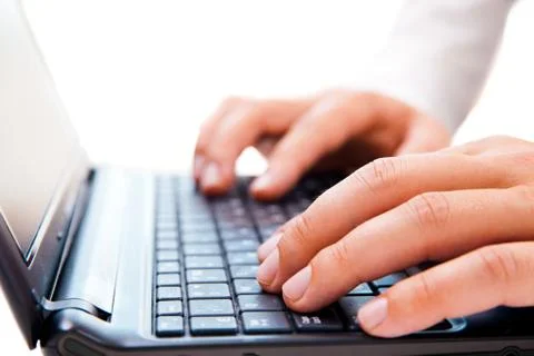 Businessman working on laptop over white Stock Photos