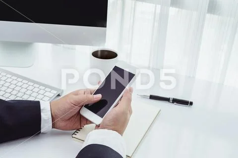 Businessman working with modern devices, computer and mobile phone Stock Photos
