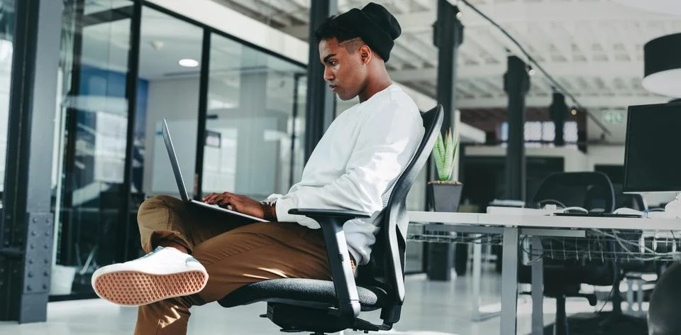 Businessman working on a new software programme in an office 库存照片