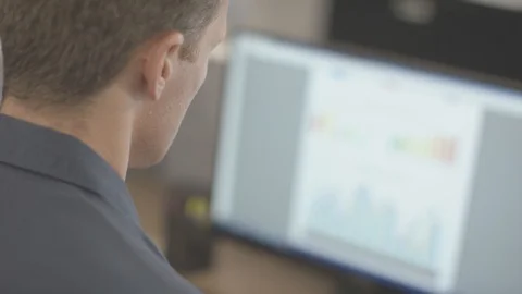 Businessman working in office on computer data input Stock Footage 94228490