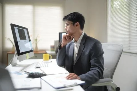 Businessman Working at Office Computer Stock Photos