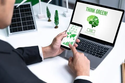 Businessman working in office developing plan on alternative energy. Gyre Stock Photos