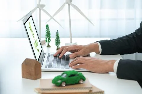 Businessman working in office developing plan on ev car. Gyre Stock Photos