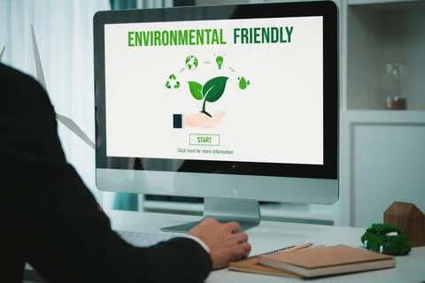 Businessman working in office developing plan on alternative energy. Gyre Stock Photos