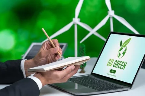 Businessman working in office developing plan on alternative energy. Gyre Stock Photos