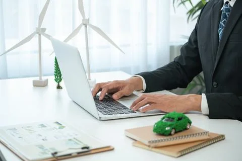 Businessman working in office developing plan on ev car. Gyre Stock Photos