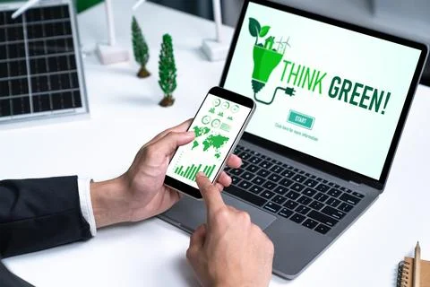 Businessman working in office developing plan on alternative energy. Gyre Stock Photos