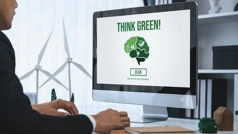 Businessman working in office developing plan on alternative energy. Gyre Stock Photos
