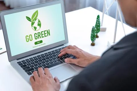Businessman working in office developing plan on alternative energy. Gyre Stock Photos