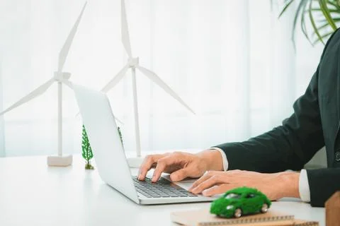 Businessman working in office developing plan on ev car. Gyre Stock Photos