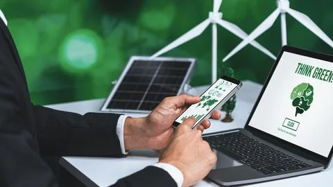 Businessman working in office developing plan on alternative energy. Gyre Stock Photos