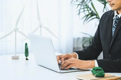 Businessman working in office developing plan on ev car. Gyre Stock Photos