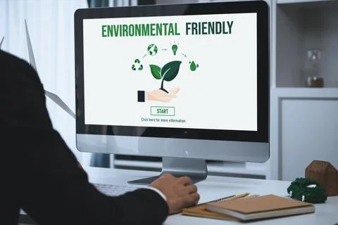 Businessman working in office developing plan on alternative energy. Gyre Stock Photos