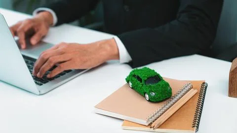 Businessman working in office developing plan on ev car. Gyre Stock Photos