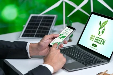 Businessman working in office developing plan on alternative energy. Gyre Stock Photos
