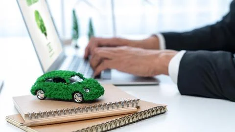 Businessman working in office developing plan on ev car. Gyre Stock Photos