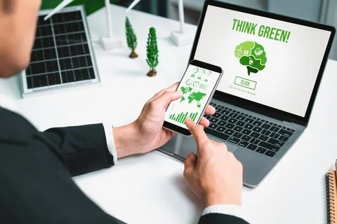 Businessman working in office developing plan on alternative energy. Gyre Stock Photos