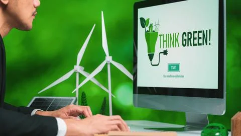 Businessman working in office developing plan on alternative energy. Gyre Stock Photos