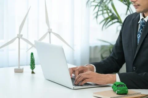 Businessman working in office developing plan on ev car. Gyre Stock Photos