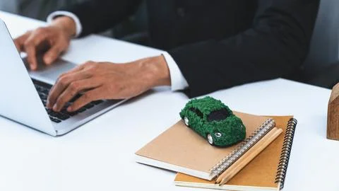 Businessman working in office developing plan on ev car. Gyre Stock Photos