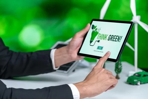 Businessman working in office developing plan on alternative energy. Gyre Stock Photos