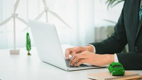 Businessman working in office developing plan on ev car. Gyre Stock Photos