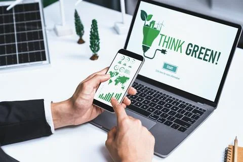 Businessman working in office developing plan on alternative energy. Gyre Stock Photos