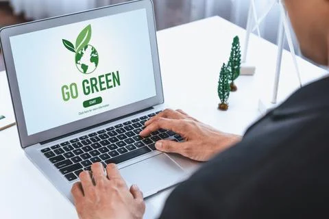 Businessman working in office developing plan on alternative energy. Gyre Stock Photos