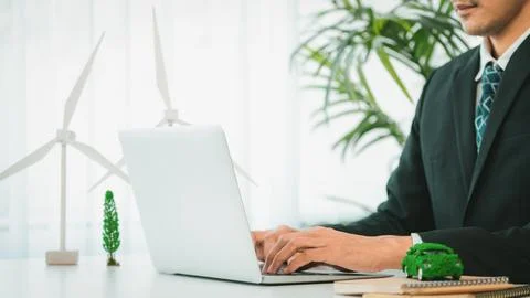 Businessman working in office developing plan on ev car. Gyre Stock Photos